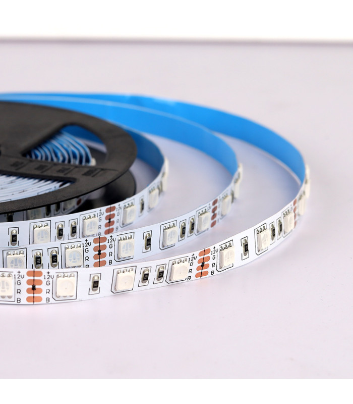 Coiled RGB LED strip with blue adhesive: A partially uncoiled RGB LED strip showing its blue adhesive backing