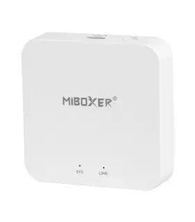 White MiBoxer 2.4GHz Gateway: Compact white gateway with the logo on the front, featuring rounded corners and minimal buttons.