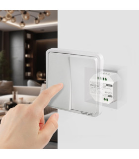 A hand pressing a wall-mounted light switch, illustrating the MiBoxer Smart Switch hidden behind the switch plate.