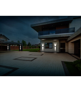 Modern home exterior illuminated by LED wall lights, showcasing their bright and uniform lighting.