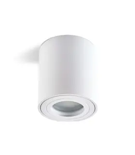 White cylindrical surface-mounted downlight installed in a modern bathroom.