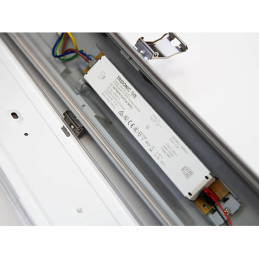 Internal view of LED batten light showing wiring and driver.