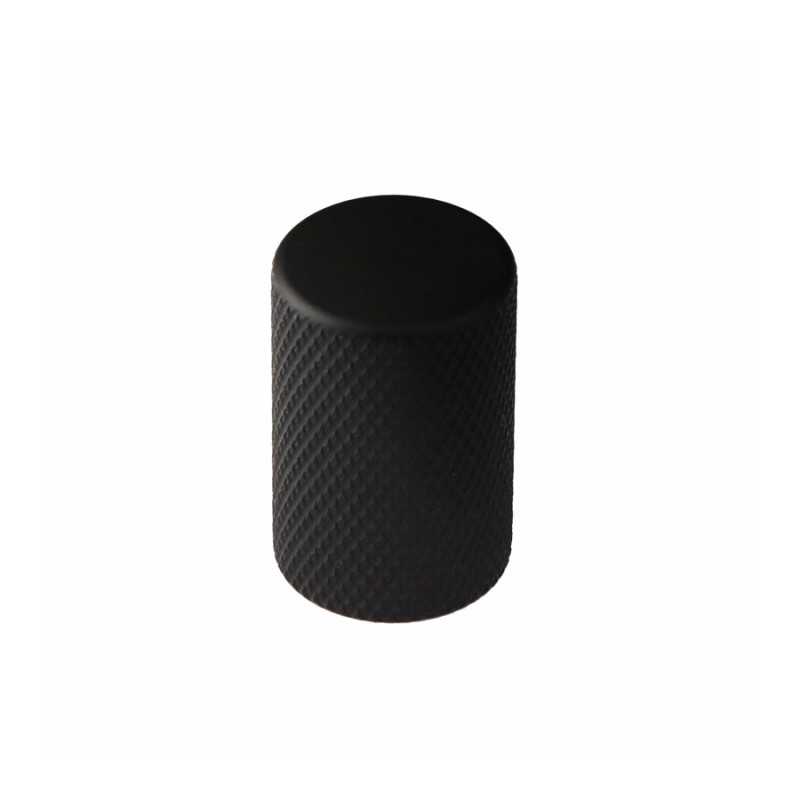 Close-up of a matte black furniture knob.