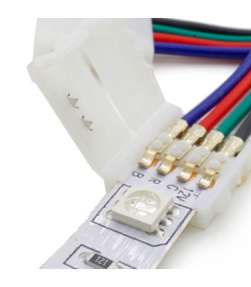 Close-up of a 10mm RGB 4-pin PCB to PCB wire connector attached to LED strip, with wires inserted.