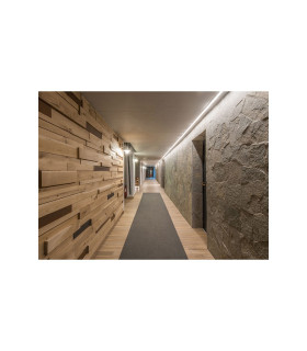 Illuminated modern corridor with a COB LED strip installed in the ceiling, providing soft lighting.