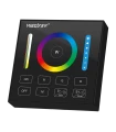 A close-up of the MiBoxer RGB+CCT panel remote, displaying its colour wheel, brightness controls, and mode buttons