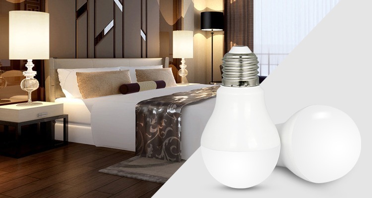 two white LED bulbs with E27 base in the bedroom next to bed side lamps