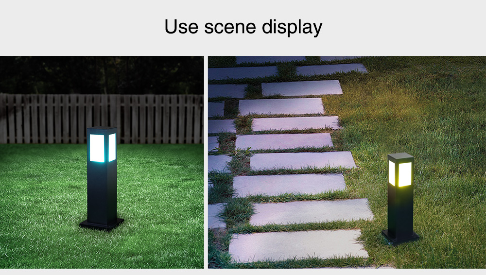 A black square LED lawn light installed along a path, illuminating the surroundings with soft, warm light.