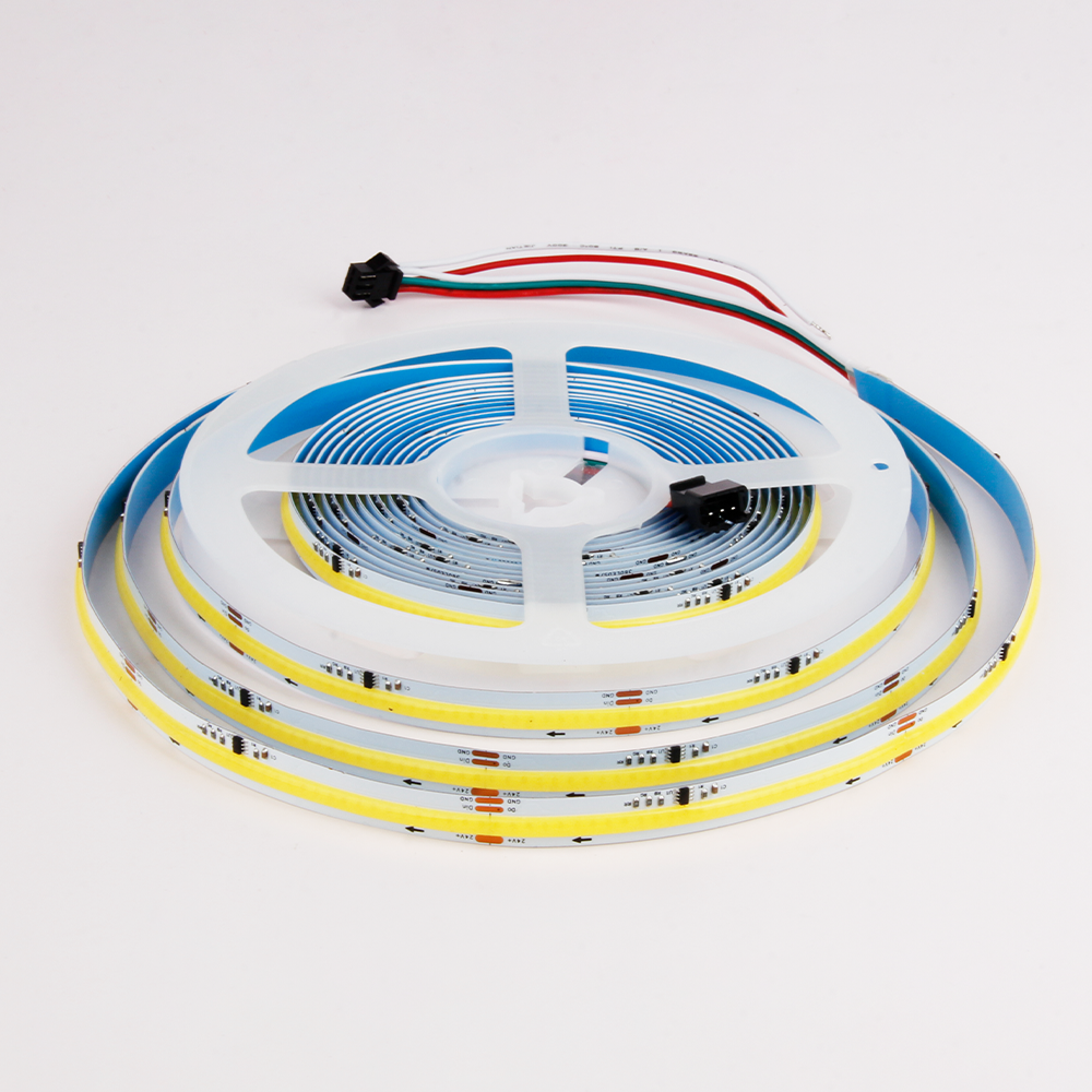 A roll of LED strip light with multi-color wiring connectors visible, coiled neatly on a plastic reel.