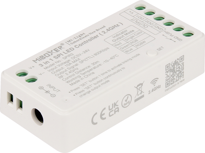 Close-up of a MiBoxer 3-in-1 SPI LED controller, showing its input/output terminals and label with technical specifications.